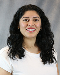 Headshot for Lissette Estrada wearing a white top.