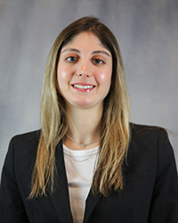 Headshot for Bianca Marquez wearing a black blazer and white top.