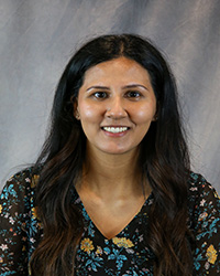 Headshot of Jaspreet Nannar wearing a flower print top.