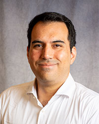 Alberto Plate-Peirano is wearing a white button down shirt.