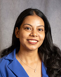 Pavan Singh is wearing a blue blouse.