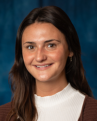 Burmeister, Nicole a woman with brown hair and a white turtleneck