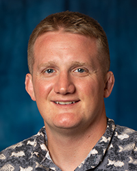 Roehl, Joseph a man with short hair wearing a camouflage shirt