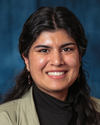 Sharma, Tanvi a woman smiling with a black turtleneck
