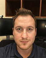 A headshot of Justin Stadler.