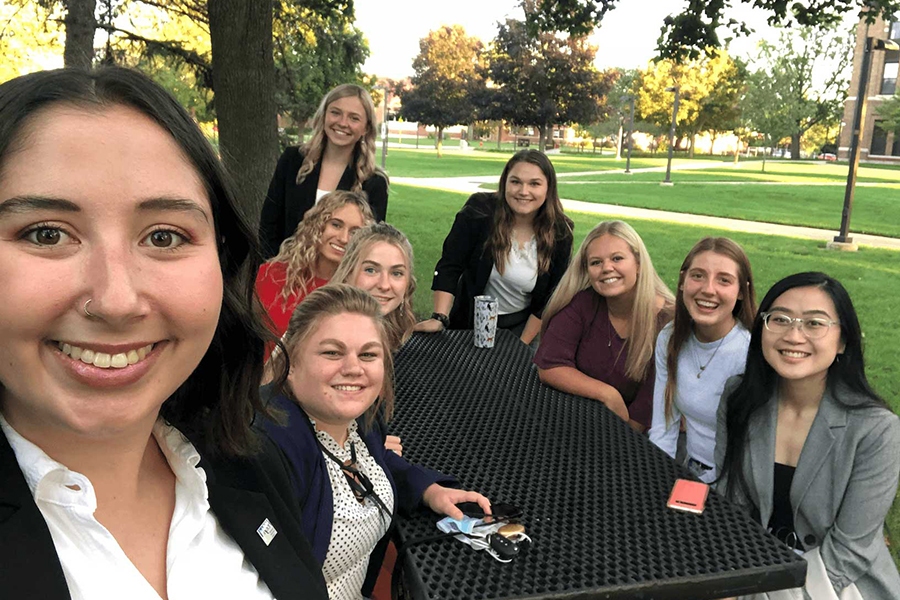 PRSSA students sitting around a picnic table