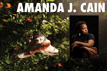 20260219_Events_Cain_003_360x240 The name Amanda J. Cain is bold across the top of the image. There is an orange tree with a pair of Nike Air Jordans hanging in it. There is also a headshot of Amanda, sitting in a chair, wearing all black with a black background.