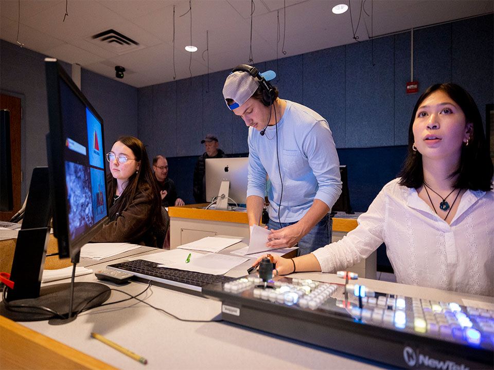 A group of students works in the control room for News Central on campus.