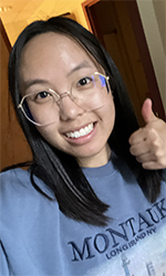 Headshot of Bryn Oakes. She's giving a thumbs-up.