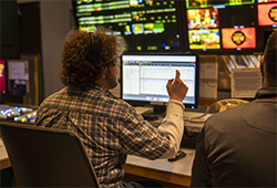 Cinematic Arts student Hugh Service working as a producer in the MHTV studio