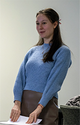 Journalism student Masha Smahliuk-Bootz standing at the front of a classroom
