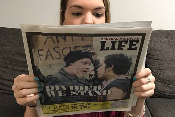 Student reading a newspaper