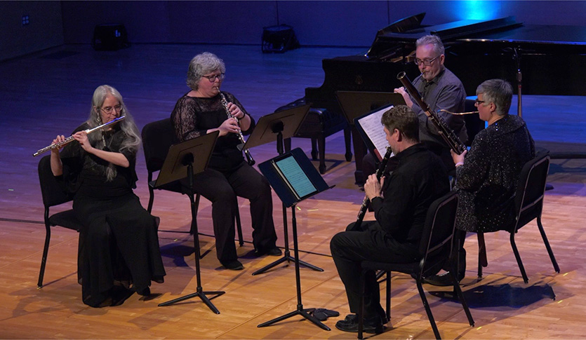 A picture of the CMU Powers Woodwind Quintet performing on stage at Staples Family Concert Hall.