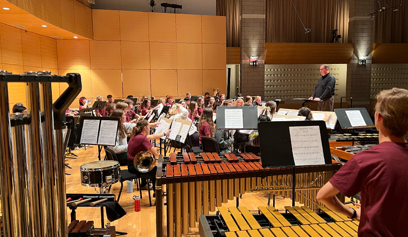 The 2022 CMU High School Honors Band performing on stage at the Staples Family Concert Hall