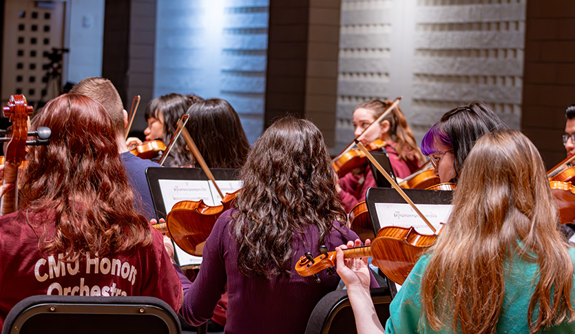 High School students are participating in the CMU honors orchestra in Staples Family Concert Hall