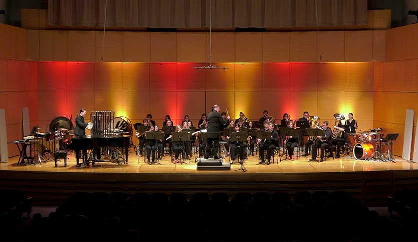 The CMU Symphonic Wind Ensemble performing in Staples Family Concert Hall under the direction of Dr. Chris Chapman.