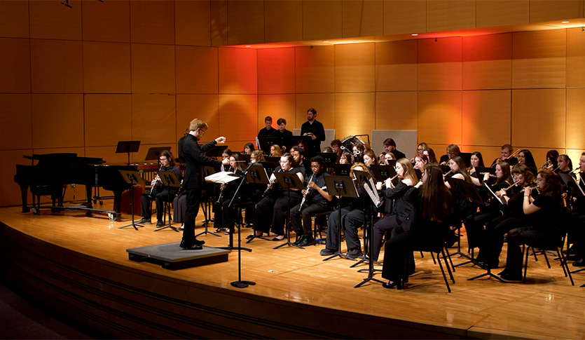The CMU University Band performing in Staples Family Concert Hall.