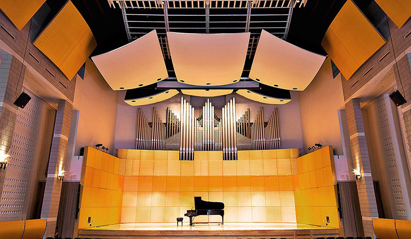 A piano on stage in Staples Family Concert Hall.