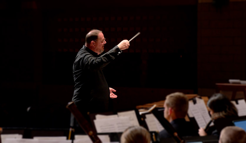 Dr. Christopher Chapman Conduction one of CMU's Bands in Staples Family Concert Hall.