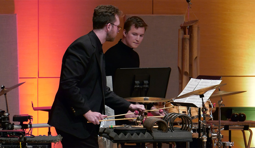 Two CMU Percussionists performing in Staples Family Concert Hall.