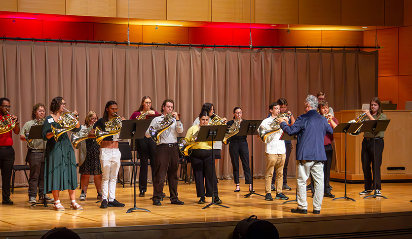 The CMU Horn Choir performing in Staples Family Concert Hall under the direction of CMU Faculty Dr. Bruce Bonnell.