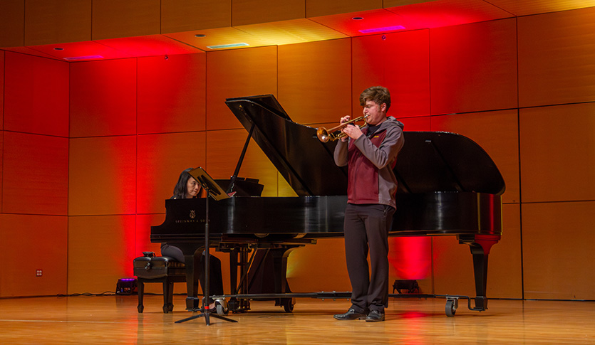 A CMU student performs a solo in Staples Family Concert Hall.
