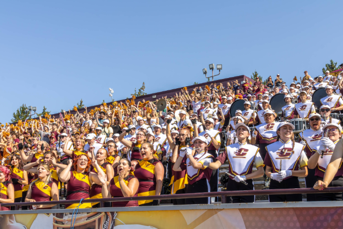 The Chippewa Marching Band cheering alongside CMU students