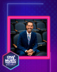 Image of a man in a suit sitting in a chair apart of a purple and pink graphic that says CMA Music Teachers on it.