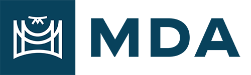 Michigan Drone Association logo. It has a box to the lsft with a line drawing of a drone flying over a structure. To the right are the letters M, D, and A, which stand for Michigan, Drone, and Association.