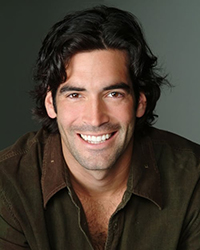 Headshot of Carter Oosterhouse with a grey backdrop.