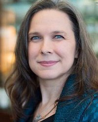 Headshot of Colleen Newvine. She's wearing a dark teal jacket.