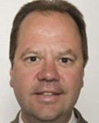 Headshot of Matt Dobek with a white backdrop.