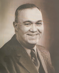 Headshot of James Stanford Bradshaw, a greyscale image cut from a newspaper.