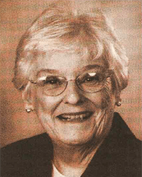 Headshot of Suzanne Nichols, a greyscale newspaper clipping