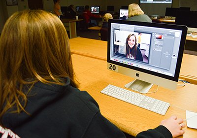 Student working on an advertising project during the Journalism Rocks program.