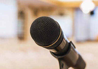 A close up of a microphone on a stand.