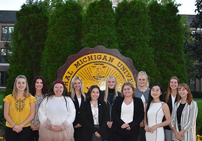 The members of PR Central stand in front of the CMU Seal.