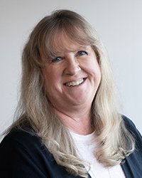 Headshot of Leanne Smith with a soft grey backdrop