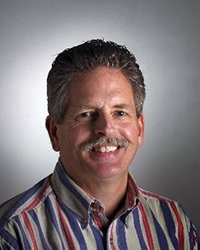 Headshot of Steve Morse with a soft grey backdrop