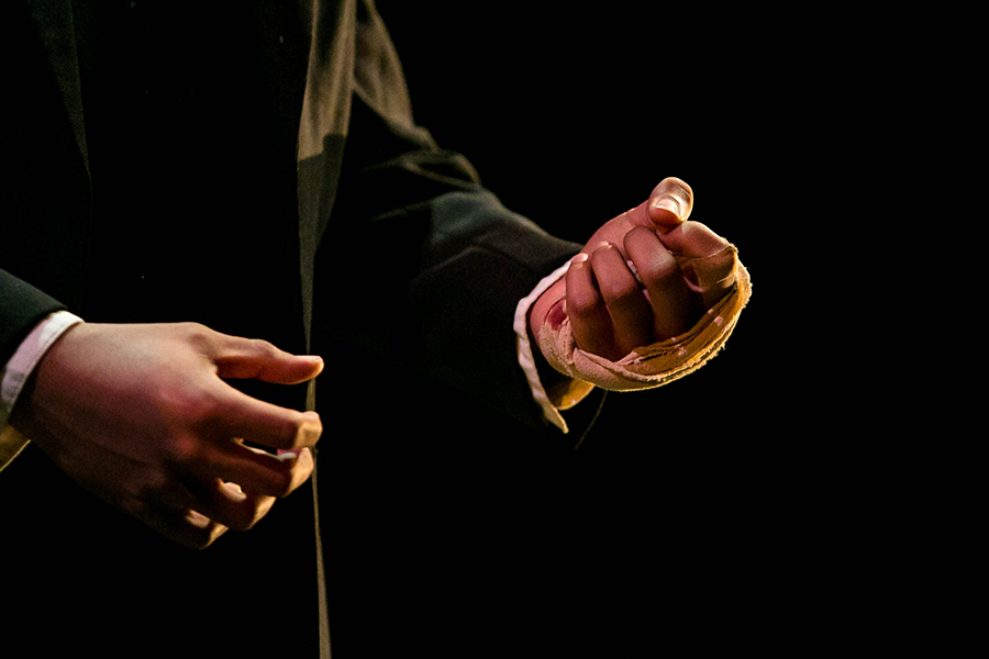 Close up of an actor's hands during a theatre performance