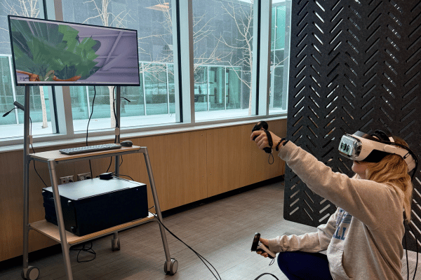 image shows a woman creating in the XR lab