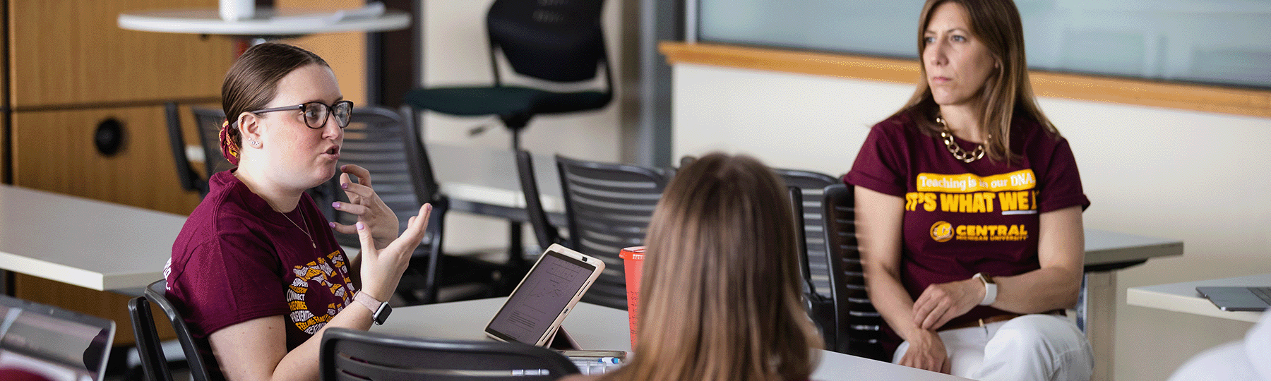 Students during a classroom discussion with a faculty member.
