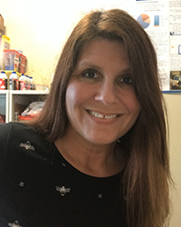 Headshot photo of Jennifer Weible, a faculty member in Educational Technology graduate programs. She is pictured with long brown hair and wearing a black shirt.