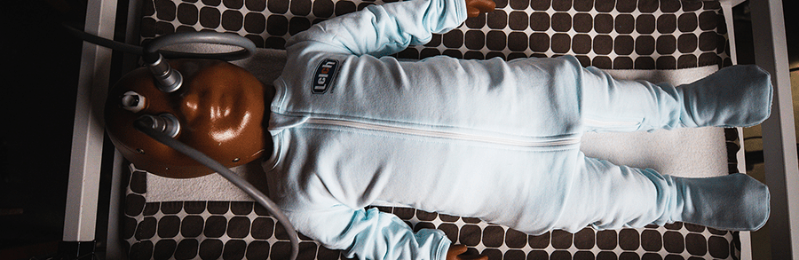 baby manikin being used to test diapers