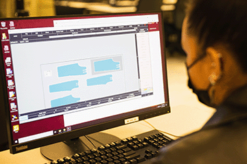 Fashion student working on pattern designs on the computer
