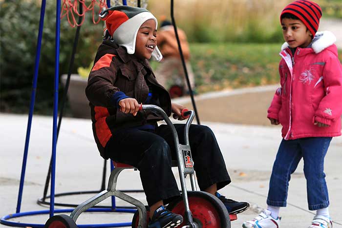 child on bike on playground