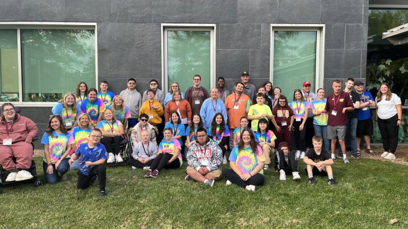 Connections that count student volunteers and participants posing for a picture outside in front of the EHS Building.