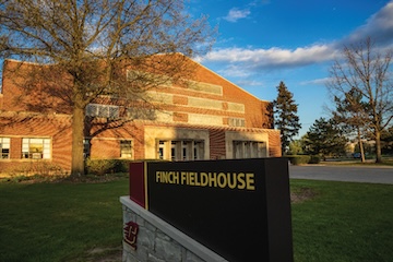 Finch Fieldhouse front exterior and building sign.