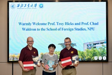 Chad Waldron and Troy Hicks with their host from China.