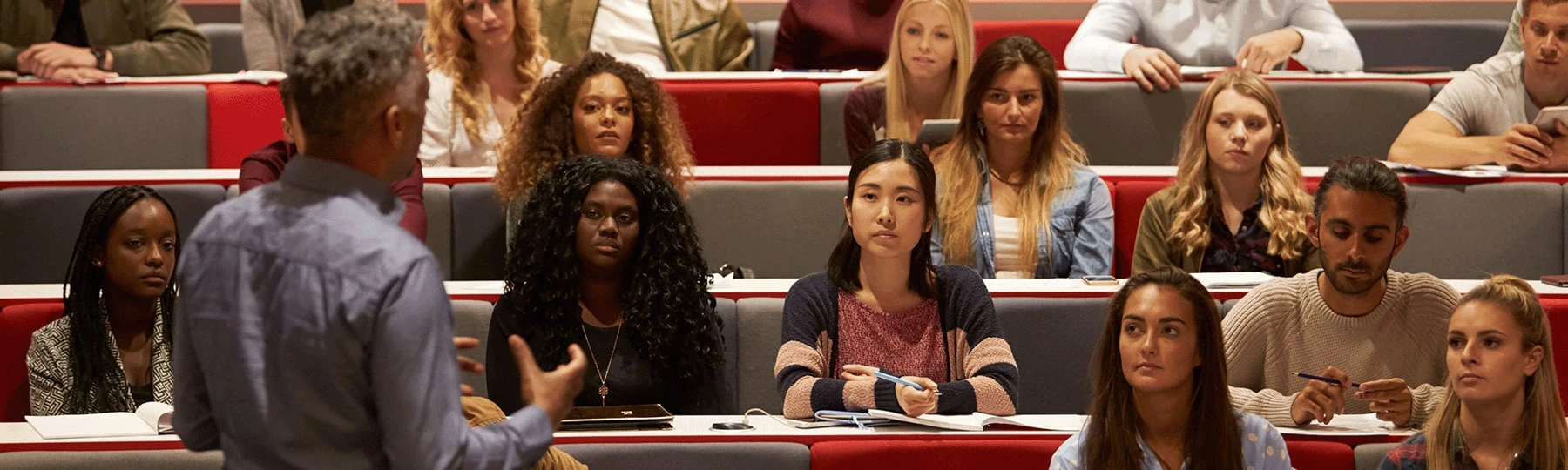 Adult educator in front of a group of students